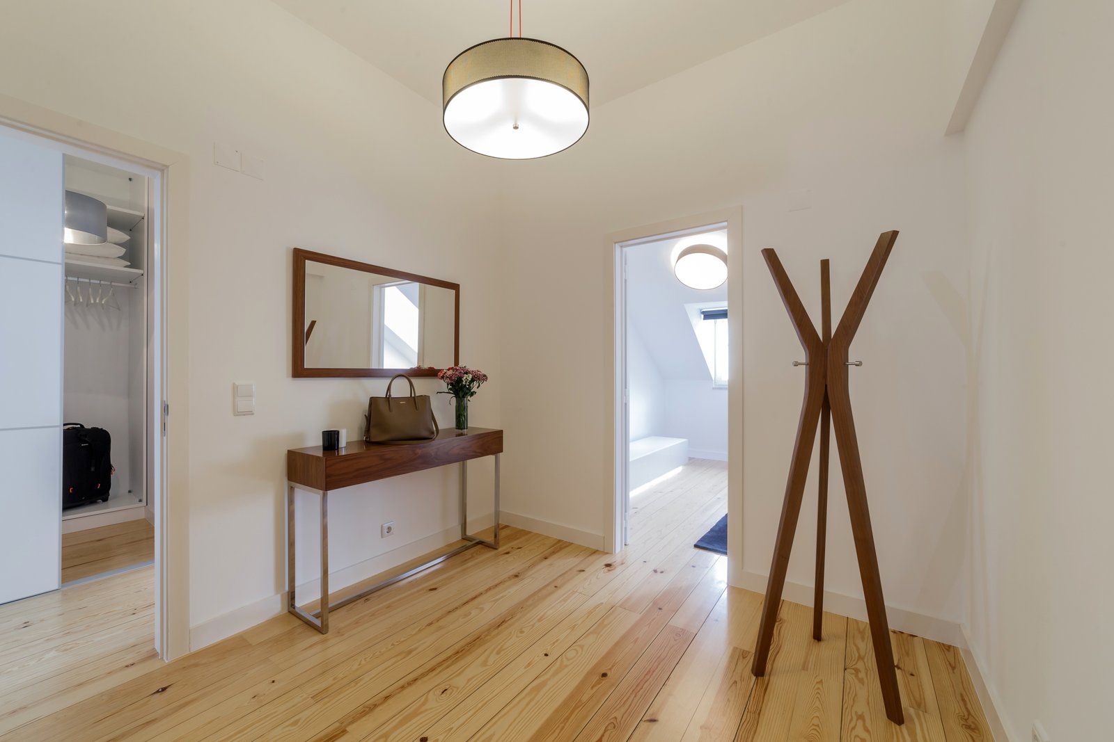 Modern apartment with white walls and light wooden floor Duplex apartment